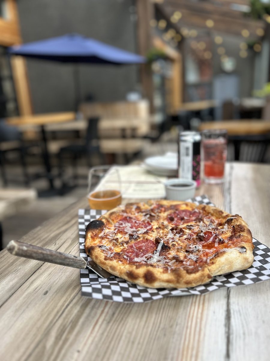 Pizza served on a restaurant patio